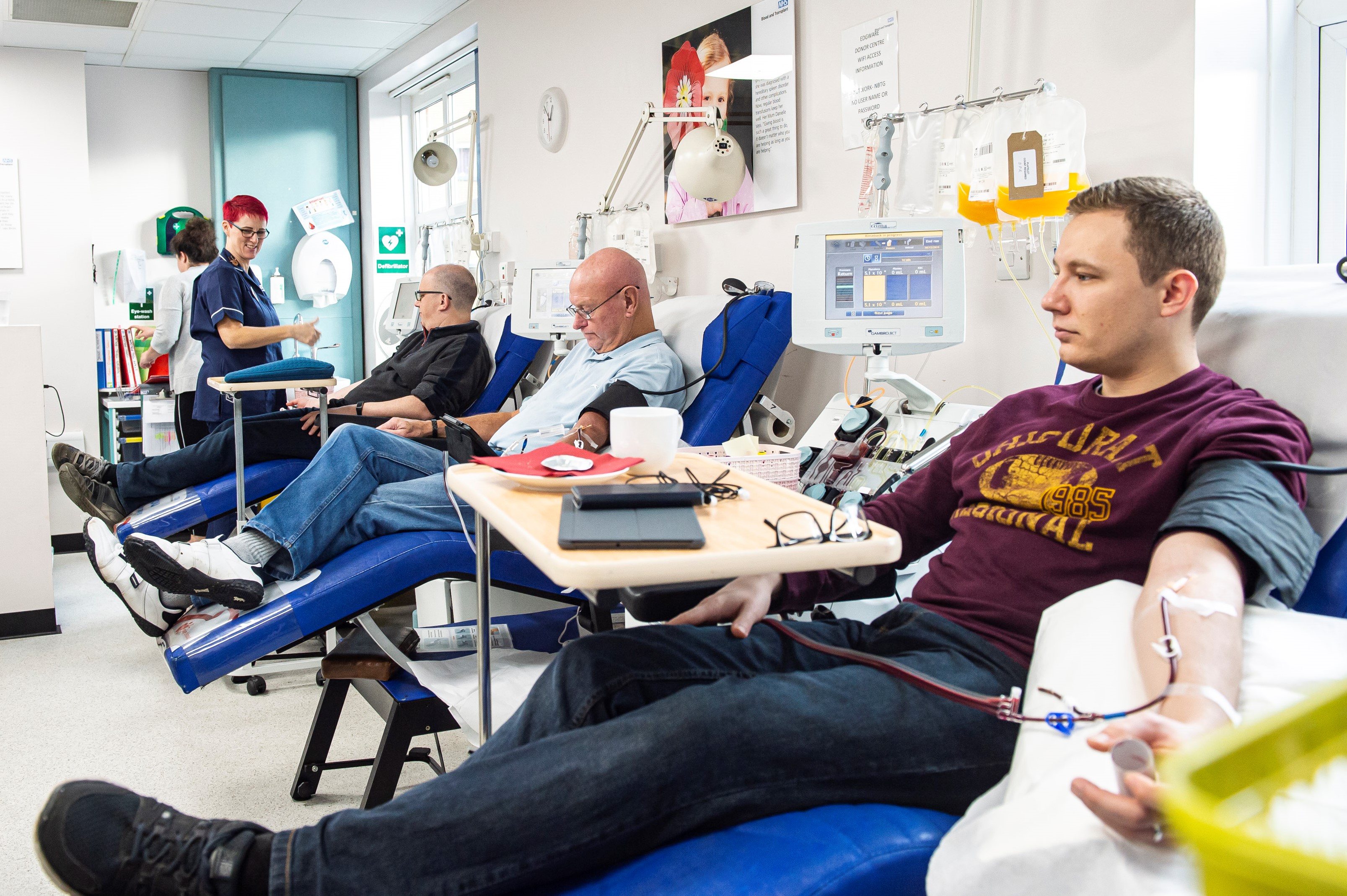 A woman donates blood at a The Renewed Hope Foundation blood drive